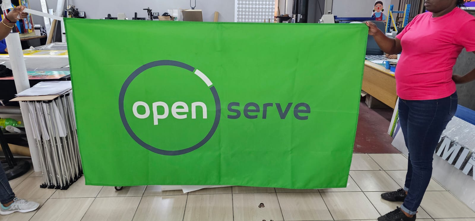 Green branded event table cover used for Openserve activation visibility